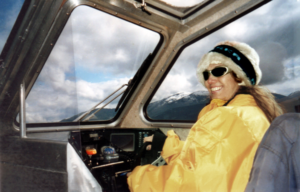 Karen Duquette driving the boat